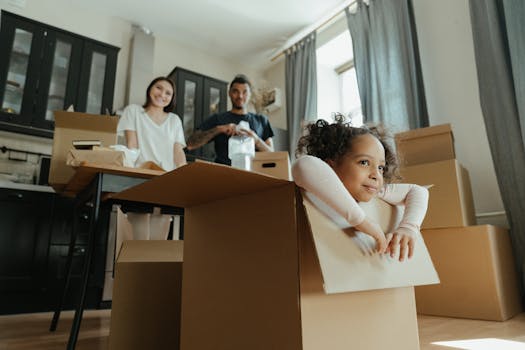 pexels-photo-4569304-4569304 Family enjoys a joyful moment while unpacking boxes in their new kitchen.